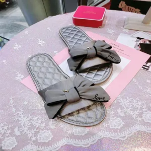 Pantoufles d'été style coréen nœud papillon en soie élégantes chaussures plates femme.