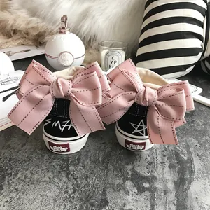 Black canvas sneakers with cute pink bow detail on heel, casual low top flat shoes for women.