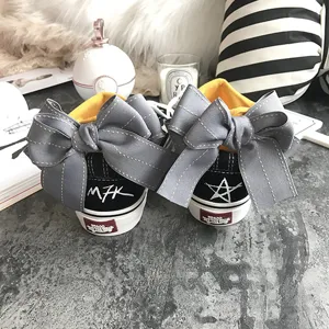 Stylish casual canvas sneakers with oversized back bow and vibrant yellow lining styles.