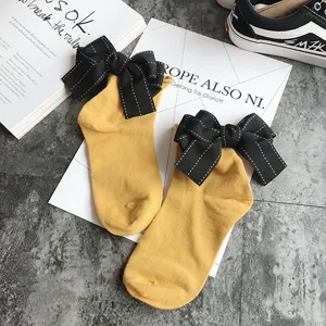 Japanese cute yellow cotton socks with large black bow on the back sweet girl student crew socks