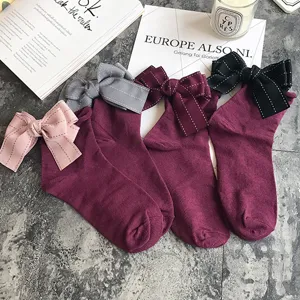 Cute back bow cotton socks detail view, soft stacked socks with rolled edge for sweet daily wear.