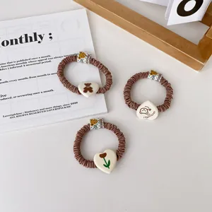 Brown pleated hair scrunchies set featuring cute bear and tulip pendants for daily hair styling.