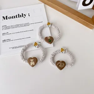 Cute pleated hair scrunchies set with cartoon bear and tulip heart charms for daily styling.
