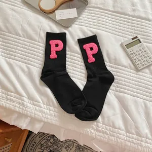 Stylish black mid-calf socks with pink embroidered letter P patch for daily comfort.