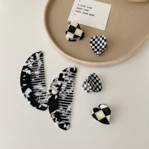 Vintage black and white checkerboard acetate hair claws and geometric side combs set.