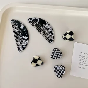 Acetate hair combs and checkered heart hair claws set, vintage black and white hair styling accessories.