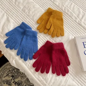 Winter warm fluffy knit five-finger gloves for women, solid color soft cozy wool mittens.