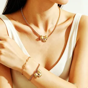 European retro multi-wear gold chain necklace and bracelet set with elegant pendant for women.