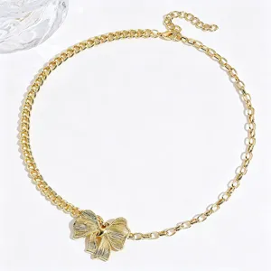 Gold-tone chunky chain necklace featuring a chic bow pendant, elegant and retro daily jewelry.