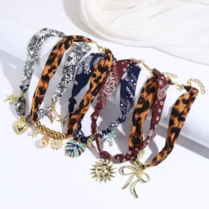 Colorful fabric silk scarf necklace with vintage leopard paisley print and cute metal pendants.