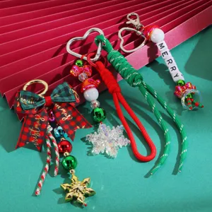 Christmas keychain detail, plaid bow bag charm, woven lanyard pendant with cute snowflake beads.