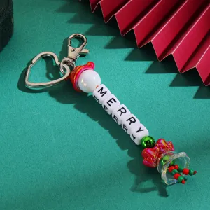 Christmas keychain with heart clasp, letter beads spelling merry, cute bow bag charm.