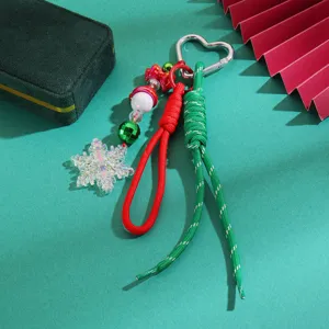 Detailed view of Christmas snowflake braided keychain with crystal pendant and vibrant cords.