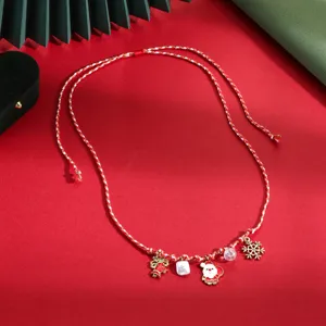 Christmas theme red braided cord necklace with cute Santa and snowflake pendants for winter.