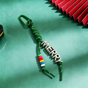 Green braided Christmas keychain with metallic MERRY letters and colorful beads detail.