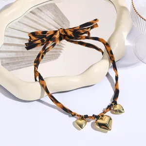 Leopard print fabric ribbon necklace with bow and gold heart pendants for women fashion
