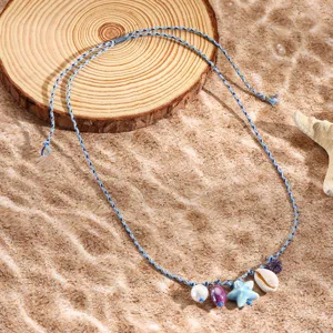 Beach style blue braided rope necklace with seashell starfish and colorful bead pendants detail view