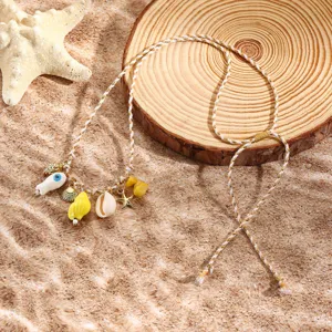 Resort style braided rope necklace featuring ocean charms including starfish, shells.