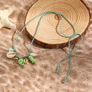 Resort style braided rope necklace with ocean seashell and cute fish pendants for beach vacation.