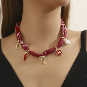 Chic red bandana fabric choker necklace with multi charms stylish pearl bow jewelry design.