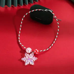Christmas snowflake pendant necklace with iridescent acrylic charm and festive braided cord for women.