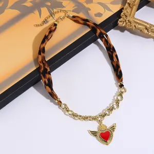 Vintage leopard print fabric and gold chain necklace with winged red heart pendant chic jewelry