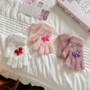 Cute kids winter plush gloves with sweet bow decoration, cozy coral fleece split finger design.