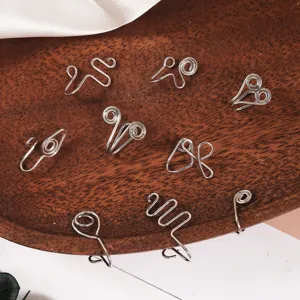 Handmade wire non-piercing fake nose rings U-shaped ear cuffs set, detailed accessory close-up.