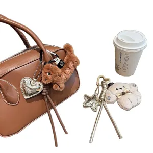 Cute cartoon dachshund plush bag charm with leather braided rope and matching cute puppy keychains.