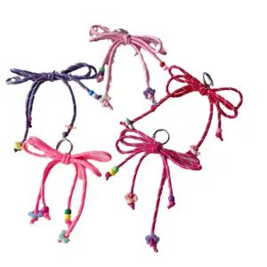 Colorful woven bow keychain and bag charm, sweet dopamine style accessory for cute daily outfits.