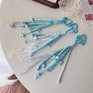 Blue lace ribbon braided lanyard, cute heart carabiner keychain and bag charm detail.