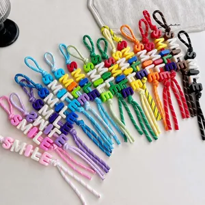 Colorful beaded braided rope bag charm with letter beads, perfect accessory for daily bags and styling.