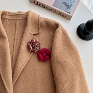 Handmade fabric camellia brooch, exquisite tweed and red floral design for elegant winter coats.