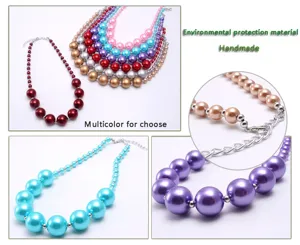 Detailed view of colorful chunky imitation pearl necklaces, showing bead size and lobster clasp.