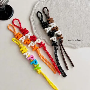 Colorful letter bead braided lanyard detail, dopamine style bag charm and key ring accessory.