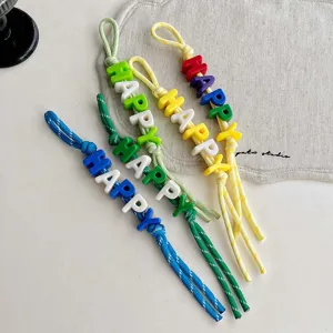 Colorful beaded braided strap keychain and bag charm with happy letters detail shot.