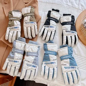 Detail shot of waterproof winter ski gloves, warm fleece-lined touch screen cycling gloves.