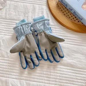 Close-up detail of winter ski gloves with non-slip palm and warm fleece lining for cold weather.
