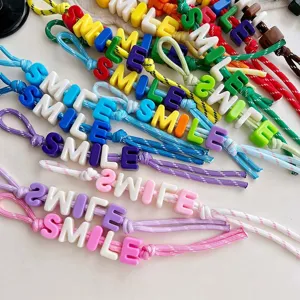 Colorful braided rope bag charm with letter beads, perfect DIY pendant accessory for daily style.