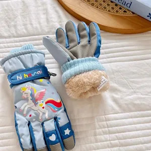 Kids winter ski gloves, fleece-lined waterproof thermal gloves with cute cartoon unicorn pattern for girls.