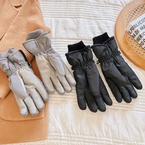Thickened winter ski gloves with waterproof and windproof design for outdoor cycling and warmth.