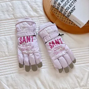 Close-up view of thermal ski gloves in light purple with anti-slip touch screen fingertips.