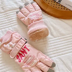 Pink winter ski gloves with touchscreen fingertips, thermal plush lining, anti-slip gear.