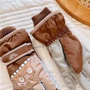 Waterproof children ski gloves with warm fleece lining and adjustable strap for winter sports.