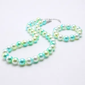 Children iridescent pearl necklace bracelet set detail view, cute gradient beaded jewelry.