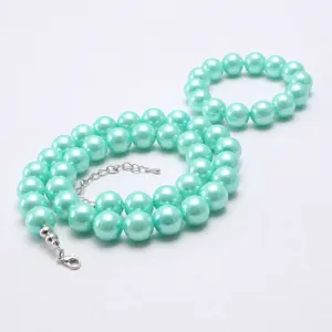 Mint green faux pearl kids necklace and bracelet set with extension chain and clasp.
