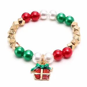 Charming Christmas children beaded bracelet detail with red white green pearls and gift box charm.