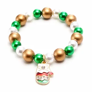 Christmas beaded bracelet for kids featuring pearl beads and a cute crystal mitten pendant.