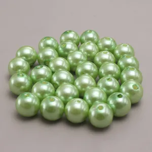 Grass green ABS plastic imitation pearl beads detail shot, perfect for DIY craft jewelry making.