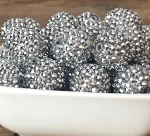Silver rhinestone resin round beads detail close up, chunky DIY charm jewelry making supply.